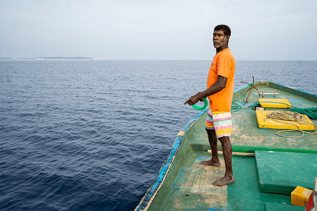 Man stood on a fishing boat